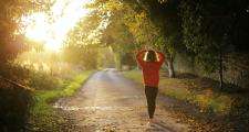 Woman walking in forest