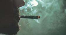 man smoking a spliff
