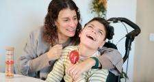 Disabled child and parent playing