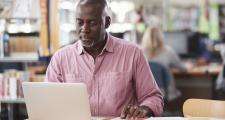 Man researching in a library