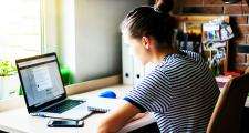 PCF - Point of entry to training: Female social work student on laptop