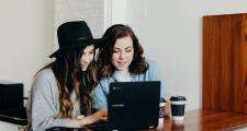 Teenagers looking at a laptop