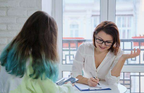 Social worker with a young person