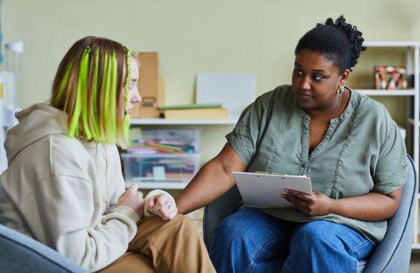 Social worker with a teenage