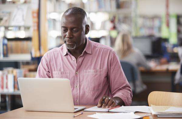 Man researching in a library