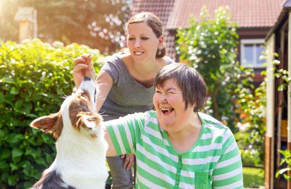 Social worker with autistic adult and autism dog