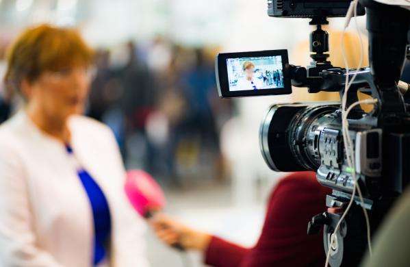 Lady being interviewed on camera