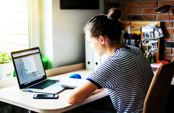 PCF - Point of entry to training: Female social work student on laptop