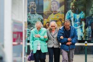 Older people walking through a town